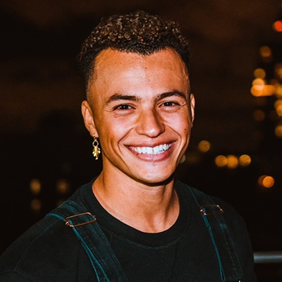 headshot of student Taydin Macon on a blurred background